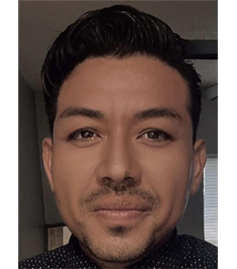 Hispanic or Latino person with black hair and brown eyes.  