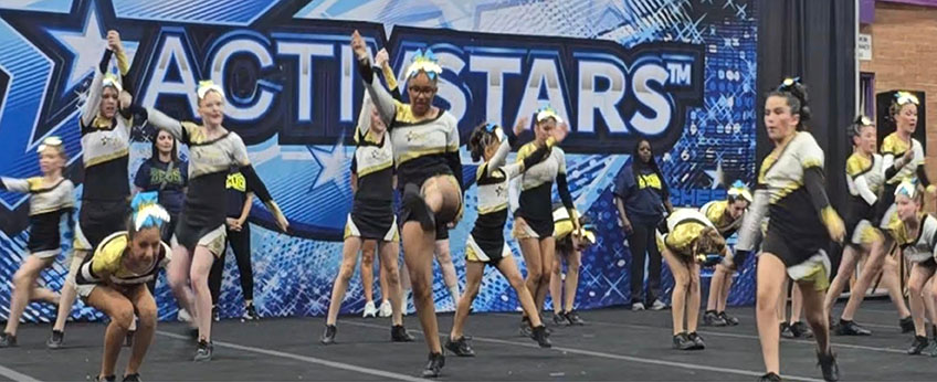 cheer team in one of their acrobatic routines