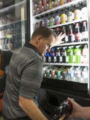 Adam Bevell restocks vending machines