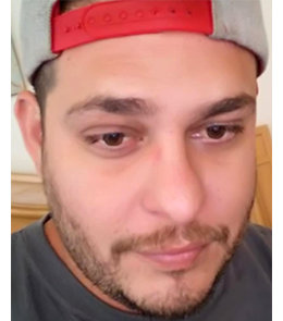 a Hispanic male with brown eyes and black hair.