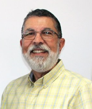 a man wearing a pale yellow shirt