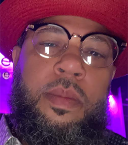 Person with beard wearing eyeglasses