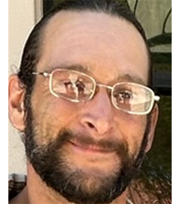 White male with brown hair and brown eyes. 