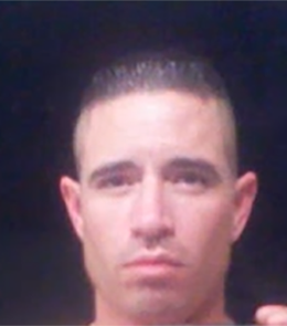 White male with brown eyes and black hair.