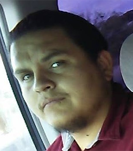 Hispanic or Latino person with brown hair and brown eyes.