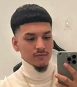 Hispanic or Latino person with black hair and brown eyes.