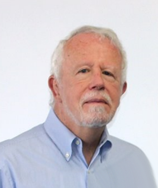 a man wearing a pale blue shirt