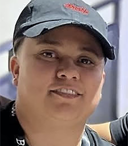Hispanic or Latino person with brown hair and brown eyes.