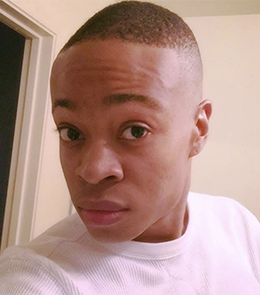 Black male with brown hair and brown eyes.