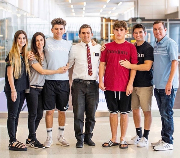 a family of 7 poses for a photo