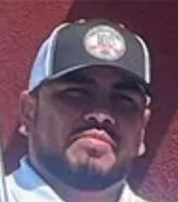 Hispanic or Latino person with black hair and brown eyes.