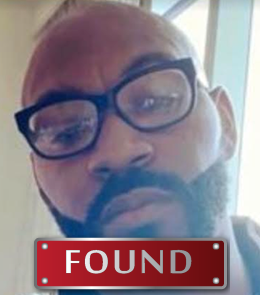 Black male with brown eyes and black hair.