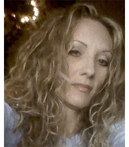White female with blonde hair and green eyes.