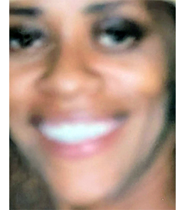 Black female brown hair and brown eyes.