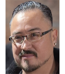 Hispanic or Latino person with black hair and brown eyes.