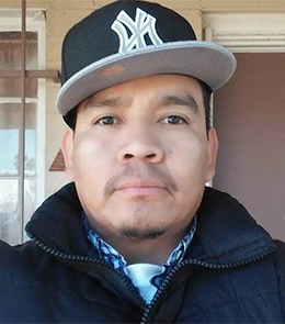 Hispanic or Latino person with brown hair and brown eyes.