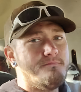 White male with brown hair and blue eyes.
