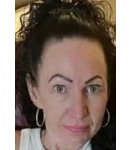 White female with green eyes and black hair.