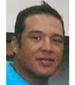 Hispanic male with black hair.