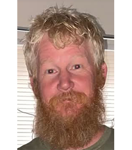 White male with blonde hair and brown eyes. 