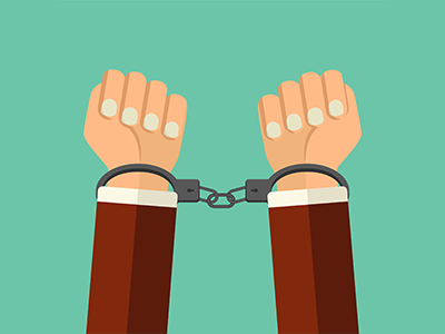 a person's wrists in handcuffs