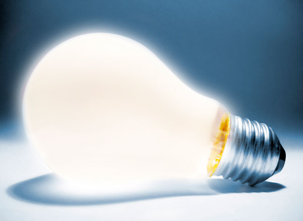 a lit lightbulb laying on its side