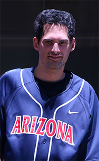 a man wearing a shirt that reads "Arizona"