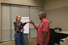 Bridging the Gap presenter and attendee sharing a moment between sessions