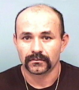 A Hispanic male with black eyes, black hair, mustache and goatee.