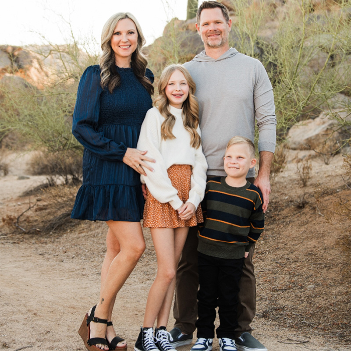 The Hillman Family taking a family portrait, with Gavin standing in the front.