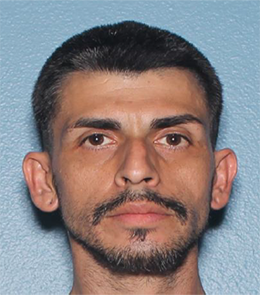 A Hispanic male with brown eyes, brown hair, mustache and goatee