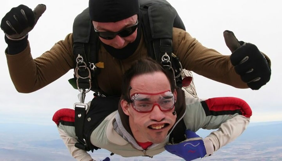 Two men are tandem skydiving