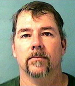 White male with brown hair, blue eyes, and goatee