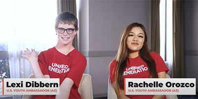 two young girls wearing red shirts that read "Unified Generation"