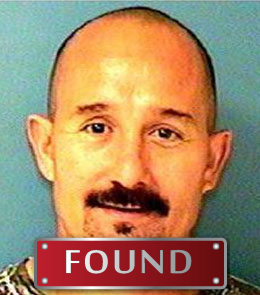 Person with short hair and a mustache