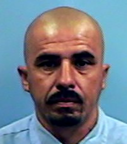 A Hispanic male with brown eyes, shaved head, mustache and goatee