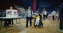 Woman using a wheelchair at a voting center