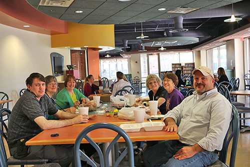 A group of people gathered at a table