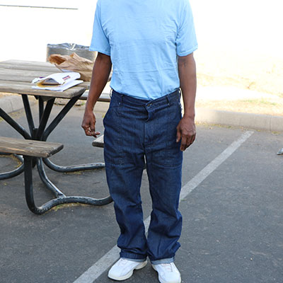 a man dressed in a t-shirt and jeans