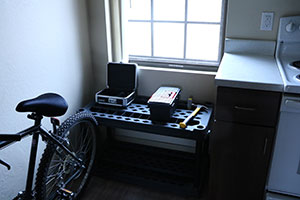 two toolboxes and a hammer on a table top