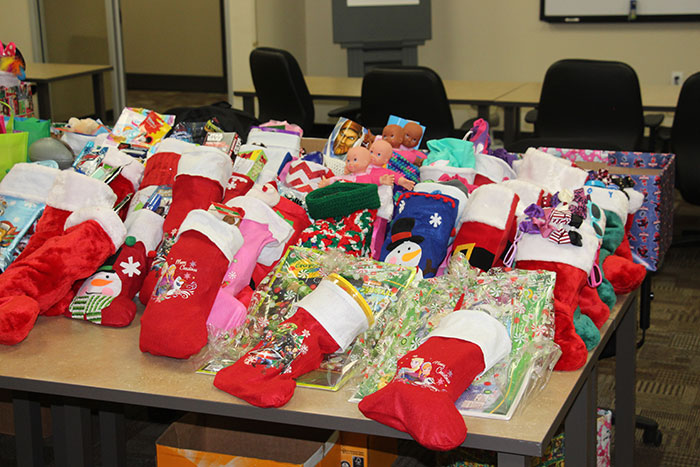 christmas stockings stuffed with candies and small toys