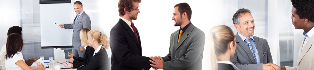 business man pointing at a flip-chart; two businessmen shake hands; three people in a meeting