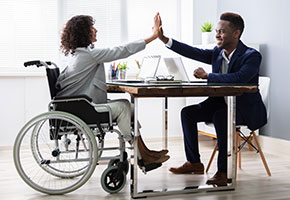 Disabled Businesswoman Giving High Five To His Partner