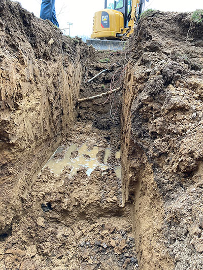 a hole dug by a nearby excavator