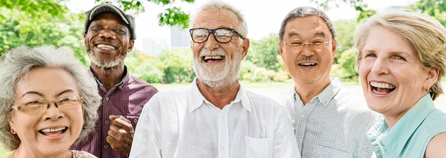 a diverse group of older adults are smiling