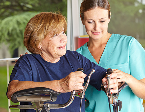 Nurse providing habilitative support to a patient at home.