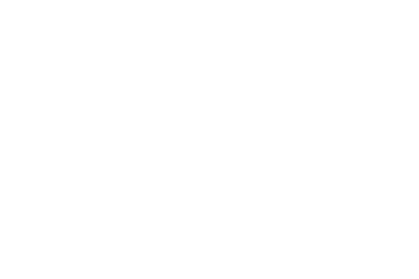 the silhouettes of two office buildings with a businessman standing nearby