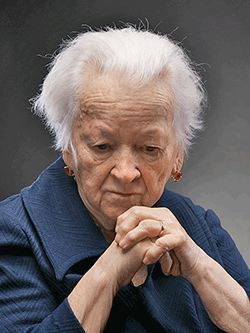 older woman with a sad, thoughtful expression