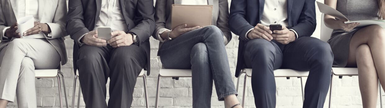 business professionals sitting in a row