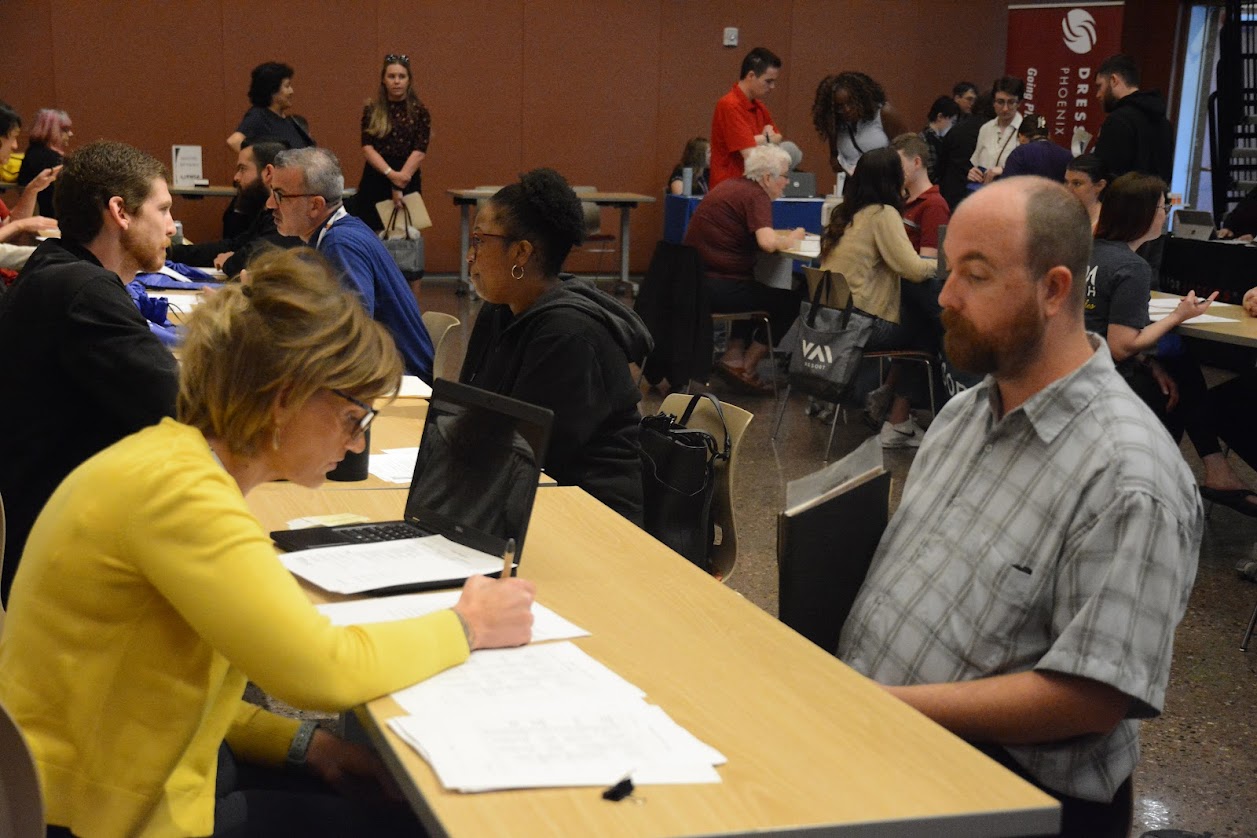 Tyler practices his soft skills through a mock interview at the  Building a DREAM Pre-Employment Fair
